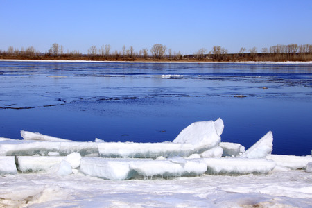 Landscape ice drift on the river in the early spring on a sunny day