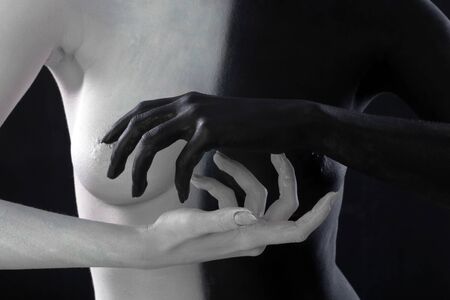 portrait nude of a slim young woman with painted body, body art in black and whiteの写真素材
