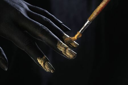 portrait nude of a slim young woman with painted body in black and white, body art performanceの写真素材
