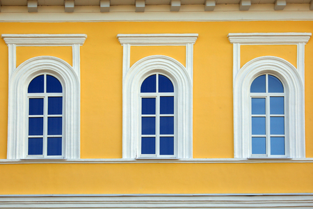 isolated closeup vintage window yellow stone houseの写真素材