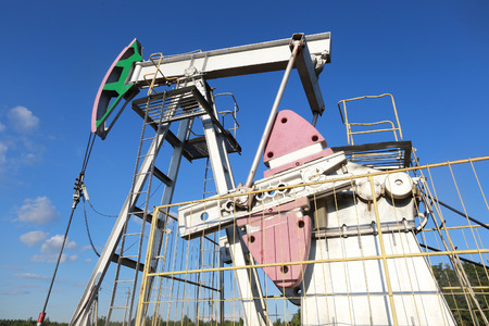 industrial landscape oil pumps in a field on a summer dayの写真素材