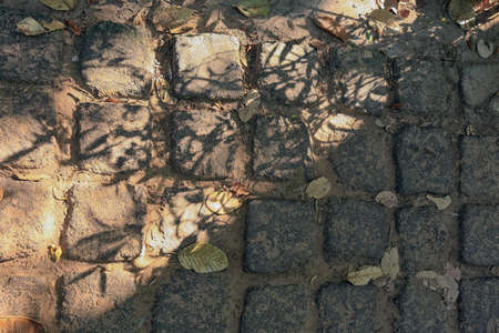 closeup background texture of a very old stone in the sunlight in Cambodiaの写真素材