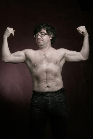 Portrait of a charismatic adult man on dark background Studioの写真素材