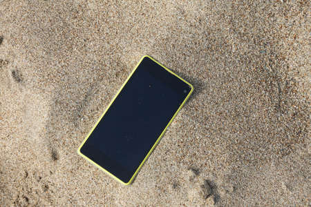smartphone on the beach.の写真素材