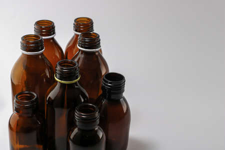 Empty brown bottles of medicine on white backgroundの写真素材
