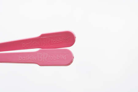 Two plastic spoons on isolated white background with negative spaceのeditorial素材