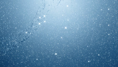 A soft blue gradient filled with countless small white snowflakes and sparkling highlights creates a magical winter atmosphere. The abstract snowfall scene conveys motion and light, ideal for holiday campaigns, winter greetings, or product backdrops needing a festive, dreamy feel.の素材