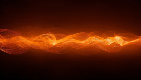 An abstract composition of flowing orange light waves across a dark gradient. The swirling, luminous curves convey energy and motion, creating a dramatic, vibrant mood suitable for technology, design, or creative projects as a header, background, or visual accent.の素材