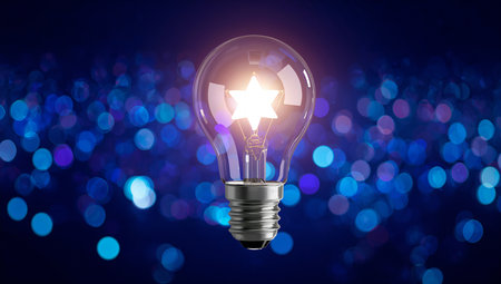 A light bulb glowing with a star-shaped filament against a bokeh background, symbolizing a bright idea or innovation.の素材