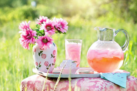 Abstract of morning juice and flowers keeps in sunlight