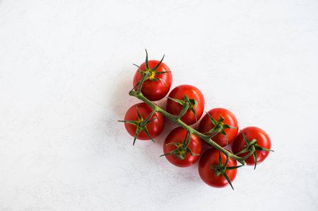Cherry tomatoes isolated over white backgroundの写真素材
