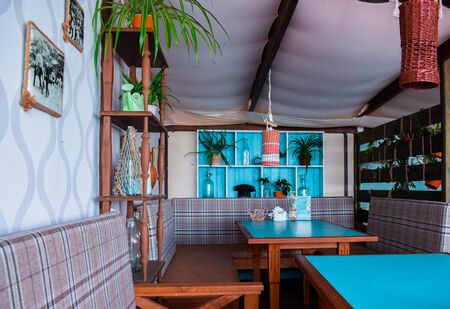 Modern restaurant or cafe interior. Public place interior design, bright blue wooden chairs, large bar counter desk.のeditorial素材