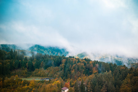clouds and fog over the village in the mountains. autumn. Germanyの写真素材