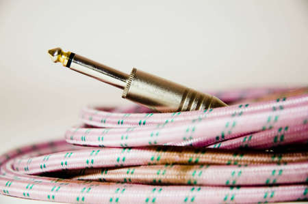 closeup  of a pink retro guitar cableの写真素材