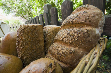 bunch of fresh baked  bread in a basket