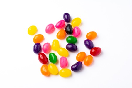 Different color candies in white background
