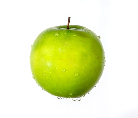 Fresh apple with water drops fallingの写真素材