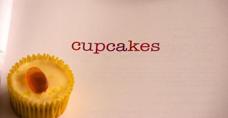 Cupcake  displayed with text on bookの写真素材