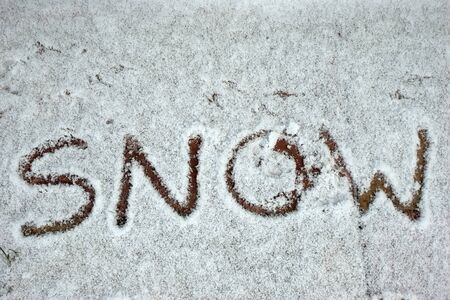 The word snow written in the snowの写真素材