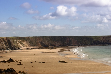 Marloes beach in Pembrokeshire with anonymous people walkingの写真素材
