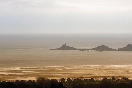 A foggy view over a beach in Wales