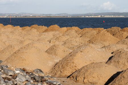Mounds of sand on a small beach in Walesの写真素材