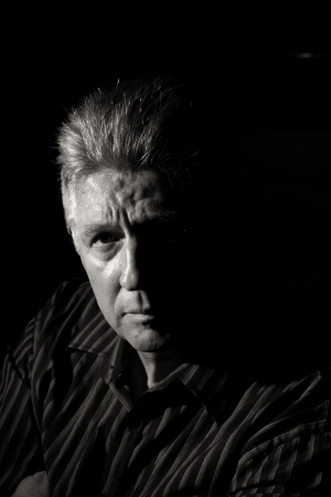 Mature moody man partial face and black backgroundの写真素材