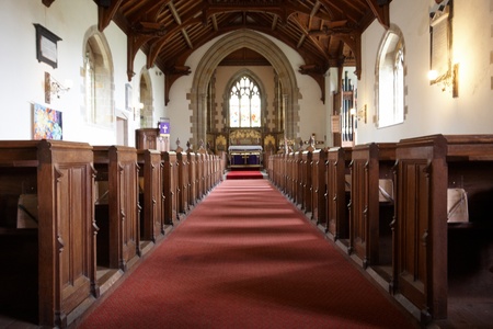 A red carpet up a church aisle