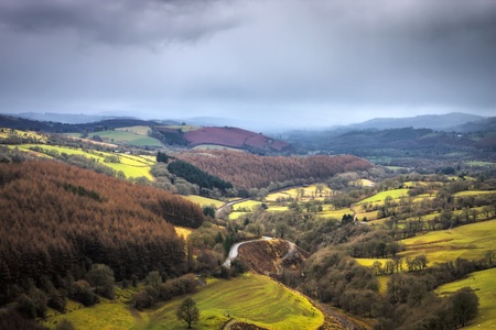 A landscape view of mountains and fields