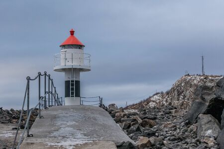 lighthouse in Laukvik in gray weather, Lofoten, Nordland, Norwayの写真素材