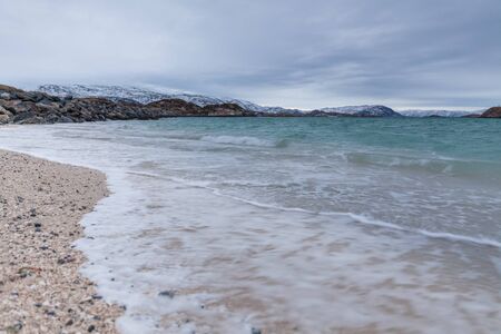 beautiful view over sand beach and fjord. Sommaroy, Norway. Winter. Polar night. long shutter speedの写真素材