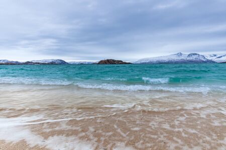 beautiful view over sand beach and fjord. Sommaroy, Norway. Winter. Polar night. long shutter speedの写真素材