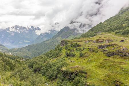 Old little houses with grass roofs. On the way to observation place in Dalsnibba mountain. Geiranger fjord Norway, selective focus.の写真素材
