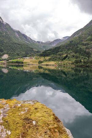 End of fjord, Beautiful Norwegian landscape. view of the fjords. Norway ideal fjord reflection in clear water. selective focusの写真素材