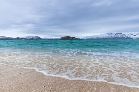 beautiful view over sand beach and fjord. Sommaroy, Norway. Winter. Polar night. long shutter speed