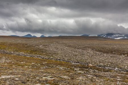 Beautiful wild nature of Sarek national park in Sweden Lapland with snow capped mountain peaks,...