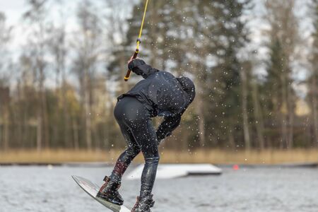 Fagersta, Sweden - Maj 01, 2020: Teenager wakeboarding on a lake during a physical education lesson.の写真素材