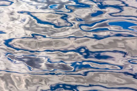 Sunlight is reflected in the water. Wonderful background.の写真素材