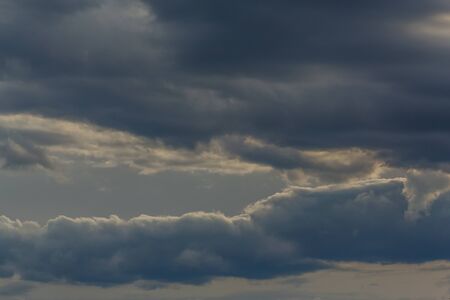 Thunderclouds on a gray sky. Beautiful background.の写真素材