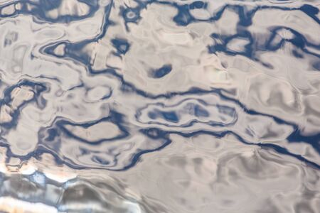 Sunlight is reflected in the water. Wonderful background.の写真素材