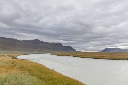 Landscapes of Mongolia. River, mountains and beautiful summer sky