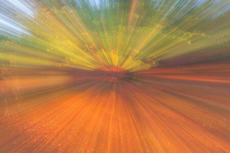 Abstract photo, forest in autumn photographed with different effects of motion and zoom. Colorful textured background. long shutter speed.の写真素材
