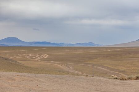 The road in the desert. Central Asia between the Russian Altai and Mongoliaの写真素材