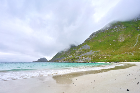 Ocean and mountain at the beach in Lofotenの写真素材