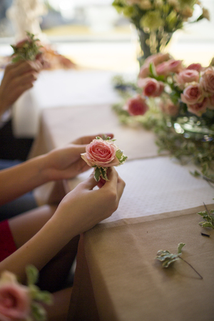 girl holding a pink rose flower on flower masterclassの写真素材