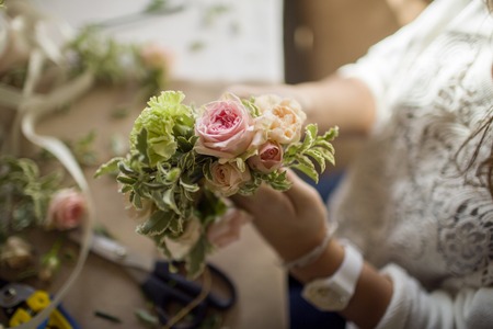 girl mastering flower composition on flower masterclass - work processの写真素材
