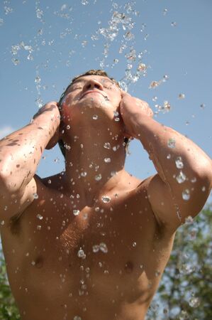 The teenager poured by water.の写真素材