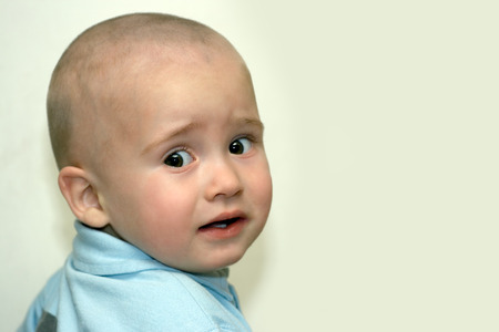 The scared sight of the little boy of one and a half years