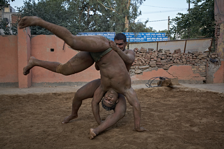 New Delhi, India, May 2012. Kushti fighters practicing in the arena.のeditorial素材