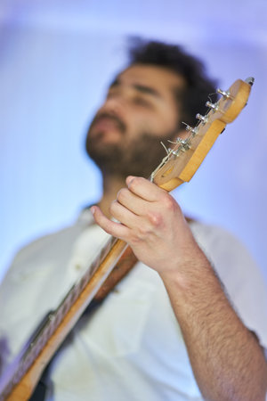 musician with piano playing music in studio